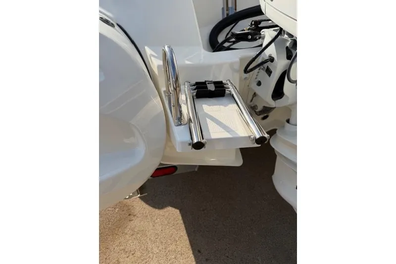 Slide: The Image of 2026 Brig Eagle 6.7 boat with stainless steel swim ladder detail. - 8