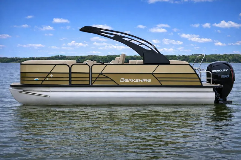 The Image of 2026 Berkshire 22 UL CTS pontoon boat on a lake with Mercury 150 engine. - 1
