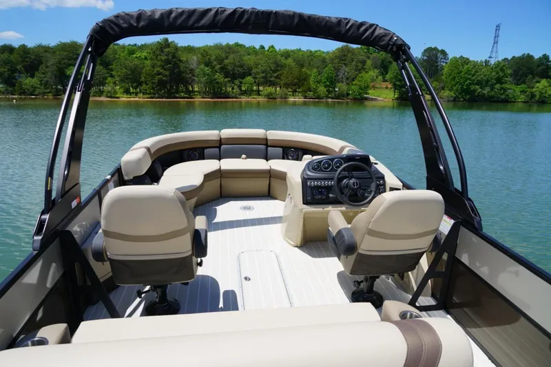 Slide: The Image of 2026 Berkshire 22 UL CTS pontoon boat interior on a serene lake. - 10