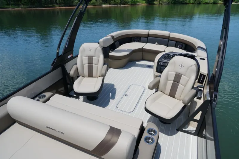Slide: The Image of Luxurious interior of 2026 Berkshire 22 UL CTS pontoon boat on a serene lake. - 12