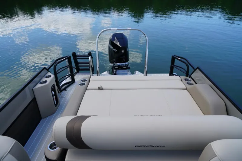 Slide: The Image of 2026 Berkshire 22 UL CTS pontoon boat with spacious seating on a serene lake. - 16