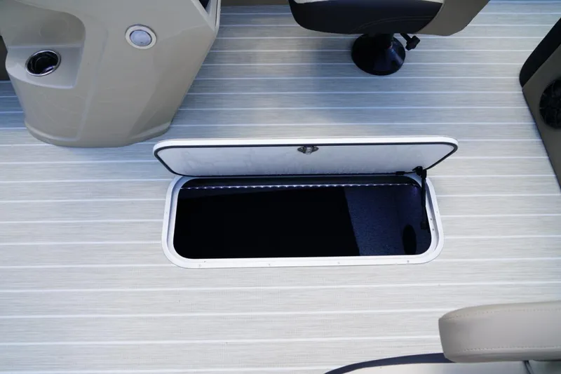Slide: The Image of Open storage compartment on 2026 Berkshire 22 UL CTS boat deck. - 17