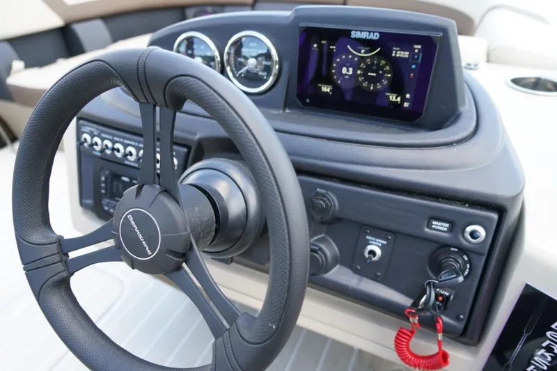 Slide: The Image of Steering console of 2026 Berkshire 22 UL CTS boat with Simrad display and controls. - 19