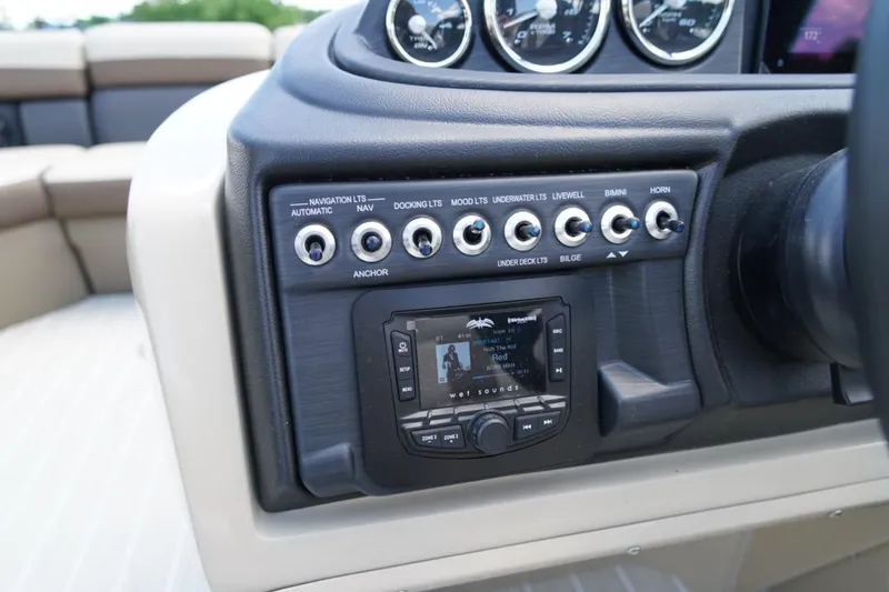 Slide: The Image of Control panel of 2026 Berkshire 22 UL CTS boat with switches and audio system. - 20