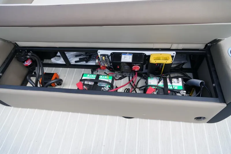 Slide: The Image of Under-seat storage with batteries in a 2026 Berkshire 22 UL CTS boat. - 22