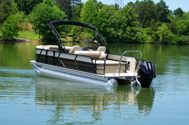Slide: The Image of 2026 Berkshire 22 UL CTS pontoon boat cruising on a serene lake. - 6