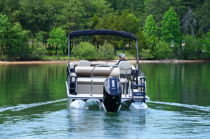 Slide: The Image of 2026 Berkshire 22 UL CTS pontoon boat cruising on a serene lake. - 7