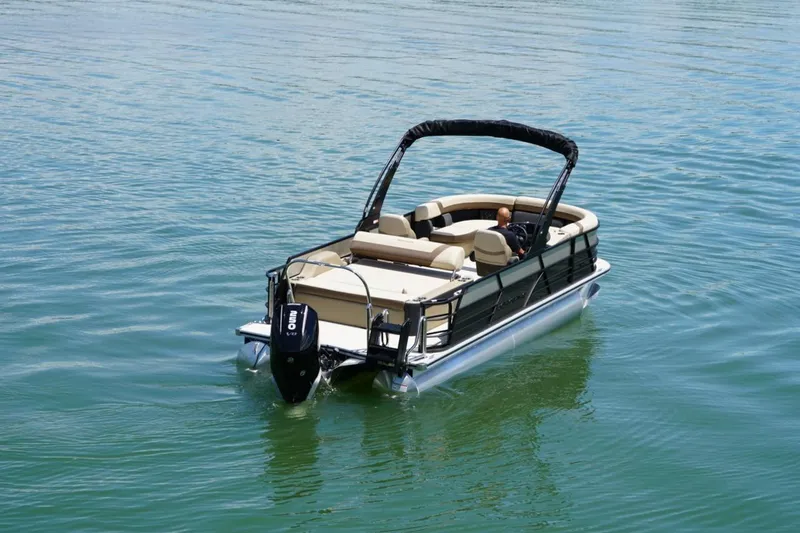 Slide: The Image of 2026 Berkshire 22 UL CTS pontoon boat on calm water. - 8