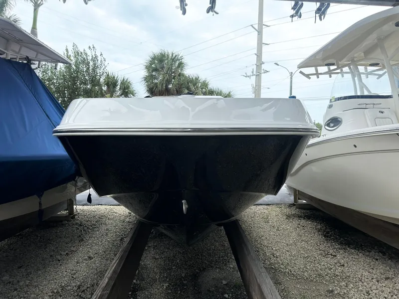 Slide: The Image of 2024 Tahoe T21 boat on display between other boats. - 7