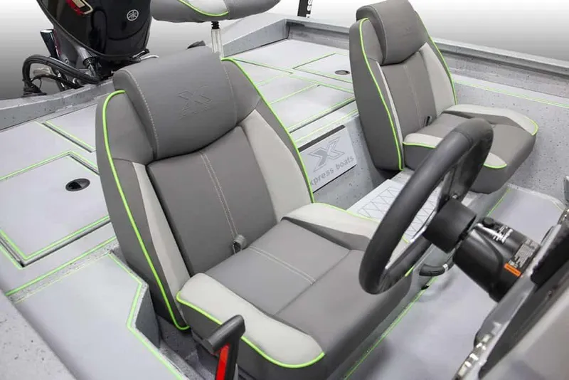 Slide: The Image of Manufacturer Provided Image: 2026 Xpress H18 boat interior with gray seats and green accents. - 10