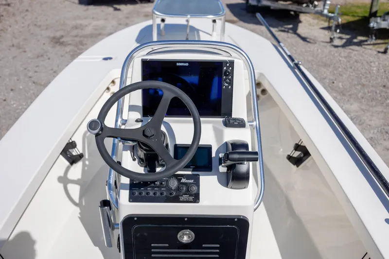 Slide: The Image of 2024 Maverick 17 HPX-S boat console with steering wheel and navigation system. - 10
