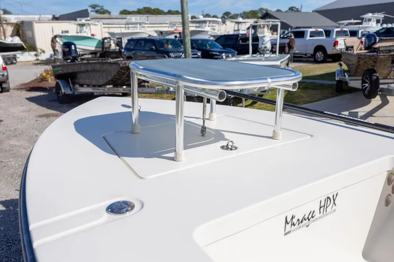 Slide: The Image of 2024 Maverick 17 HPX-S boat deck with elevated platform in a marina setting. - 15