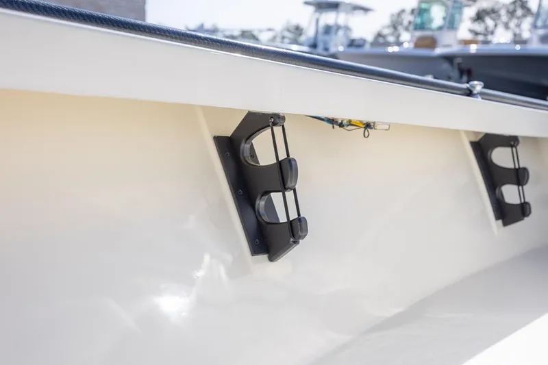 Slide: The Image of 2024 Maverick 17 HPX-S boat interior with rod holders, showcasing sleek design. - 20