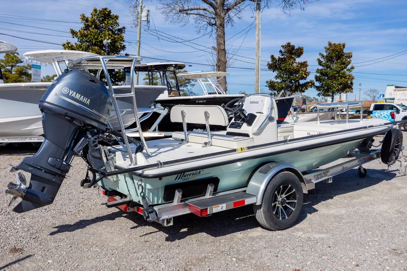 Slide: The Image of 2024 Maverick 17 HPX-S boat with Yamaha engine on trailer, parked outdoors. - 4