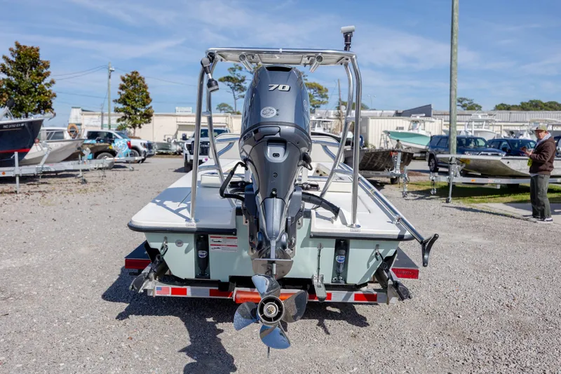 Slide: The Image of 2024 Maverick 17 HPX-S boat with outboard motor in a marina setting. - 7