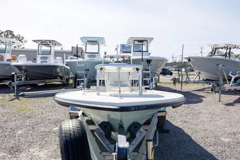 Slide: The Image of 2024 Maverick 17 HPX-S boat on trailer, surrounded by other boats in a dealership lot. - 8