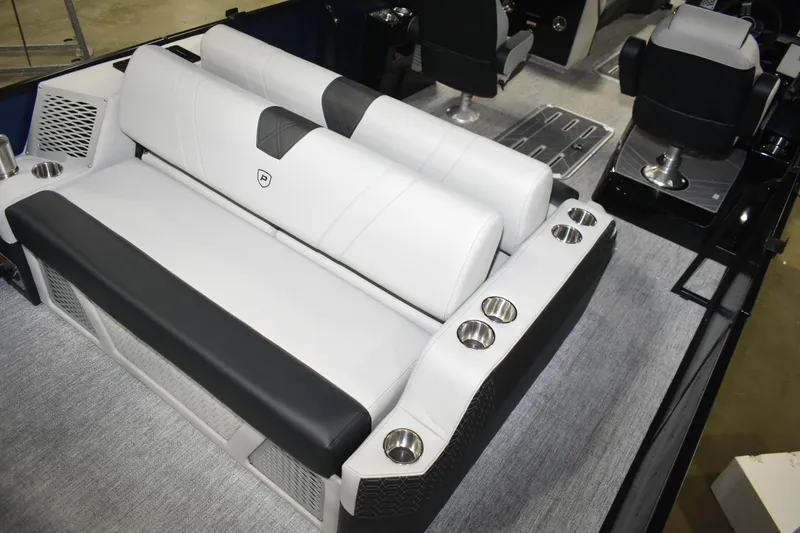 Slide: The Image of 2026 Premier 250 Intrigue RLO - CL boat interior with luxurious seating and cup holders. - 19