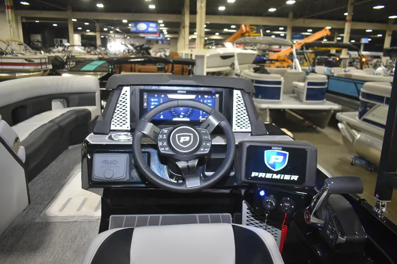 Slide: The Image of Interior view of 2026 Premier 250 Intrigue RLO - CL boat dashboard at a showroom. - 5