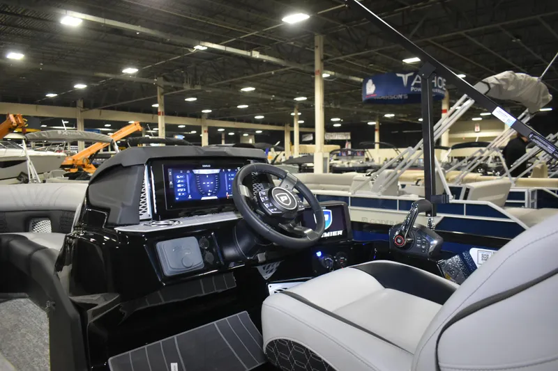 Slide: The Image of Interior view of 2026 Premier 250 Intrigue RLO - CL boat at an indoor showroom. - 6