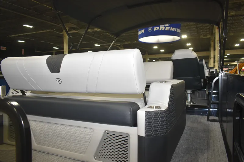 Slide: The Image of 2026 Premier 250 Intrigue RLO-CL boat interior with modern seating and cup holders. - 9
