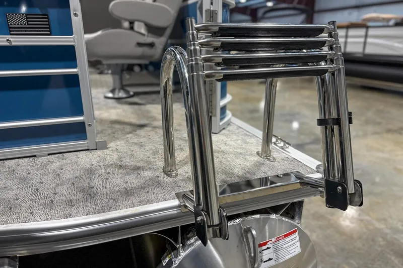 Slide: The Image of Stainless steel ladder on 2025 Trifecta 24TRFC LE pontoon boat deck. - 5