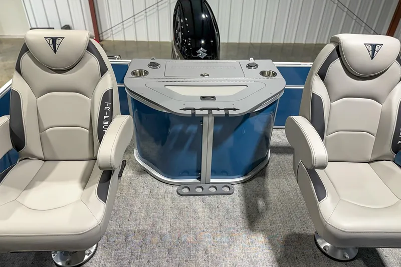 Slide: The Image of 2025 Trifecta 24TRFC LE boat interior with two luxury seats and a central console. - 6