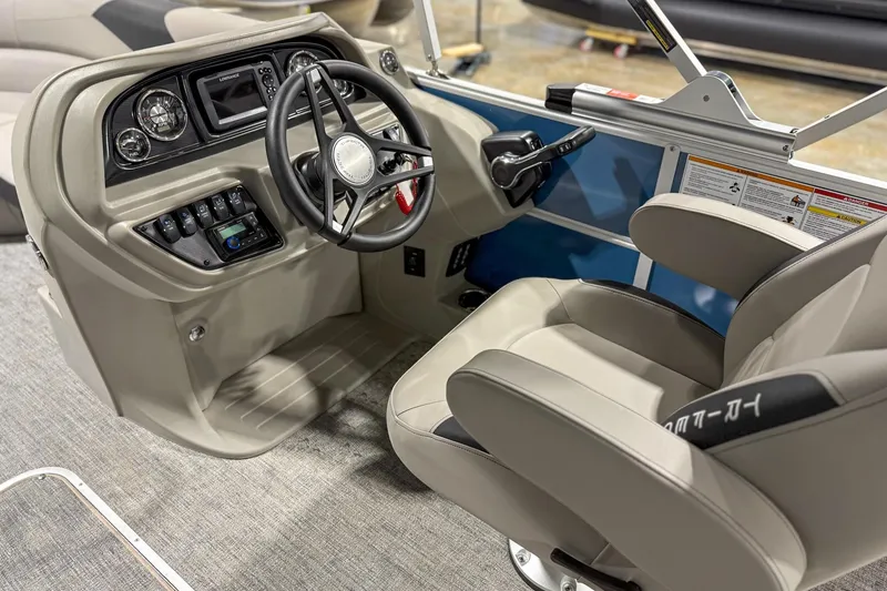 Slide: The Image of 2025 Trifecta 24TRFC LE boat interior with steering wheel and control panel. - 8