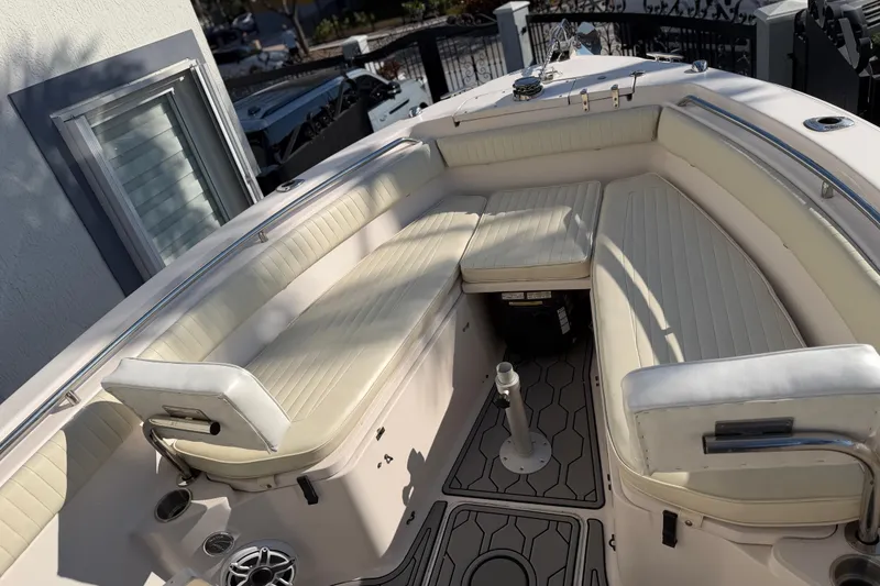 Slide: The Image of 2004 Grady White 273 boat interior with cushioned seating and modern design. - 101