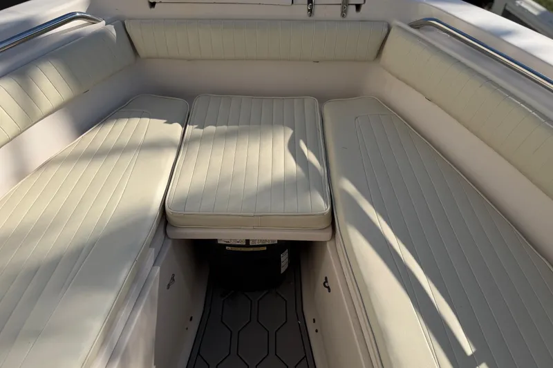 Slide: The Image of Interior seating of 2004 Grady White 273 boat with cushioned benches. - 104