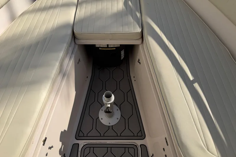 Slide: The Image of 2004 Grady White 273 boat interior with cushioned seating and deck fittings. - 106