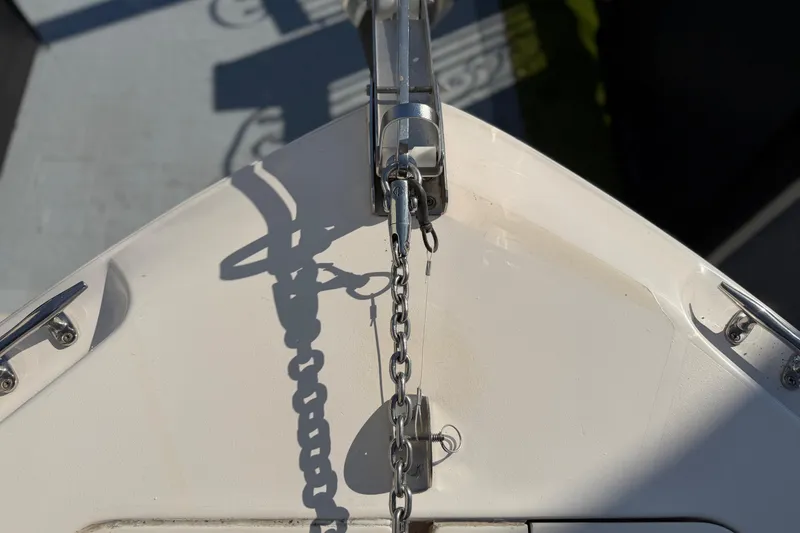 Slide: The Image of Bow of 2004 Grady White 273 boat with anchor chain and cleats. - 110