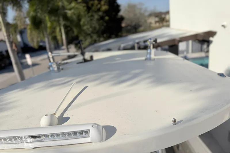 Slide: The Image of 2004 Grady White 273 boat deck with antenna and light, sunny day. - 115