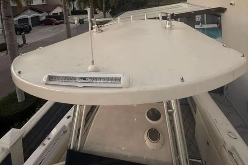 Slide: The Image of 2004 Grady-White Chase 273 boat top view with antenna and light bar. - 117