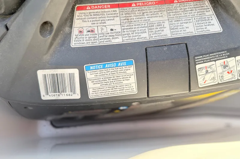 Slide: The Image of Warning labels and maintenance instructions on a Grady White 273, 2004 model. - 126