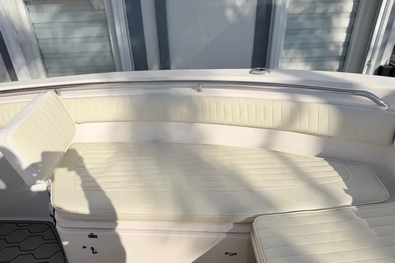 Slide: The Image of 2004 Grady White 273 boat interior with cream seating and stainless steel railing. - 129