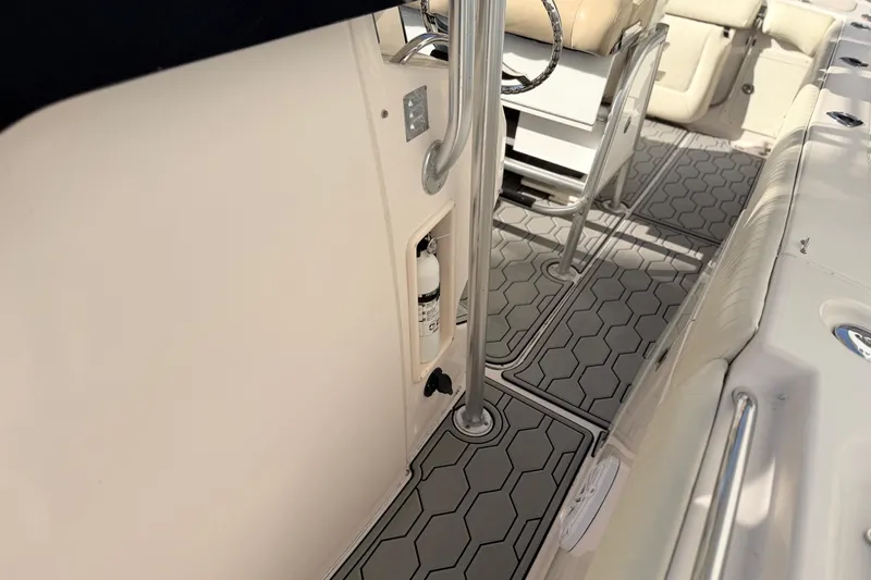 Slide: The Image of Interior of 2004 Grady White 273 boat with hexagonal patterned flooring and seating. - 141