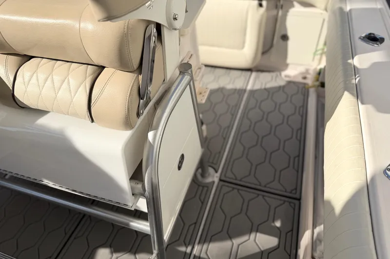 Slide: The Image of 2004 Grady White 273 boat interior with beige seating and textured flooring. - 146