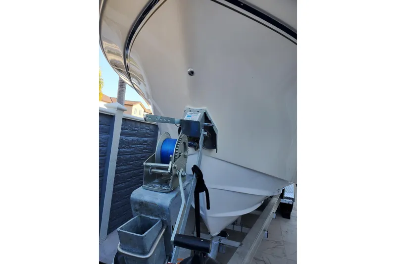 Slide: The Image of 2004 Grady-White Chase 273 boat on trailer, close-up view of bow and winch. - 152