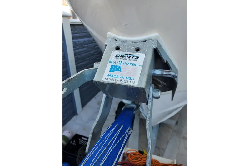 Slide: The Image of Close-up of a 2004 Grady-White Chase 273 boat trailer hitch with USA label. - 153