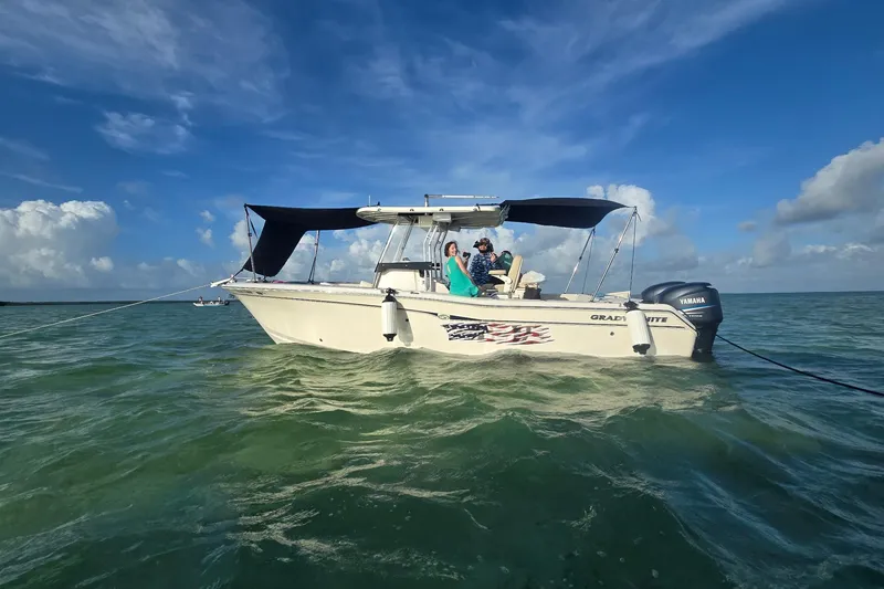Slide: The Image of 2004 Grady-White Chase 273 boat on calm sea with blue sky background. - 155