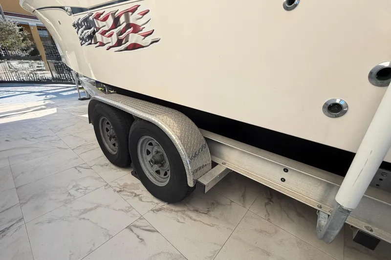 Slide: The Image of 2004 Grady White 273 boat on trailer with American flag decal. - 16