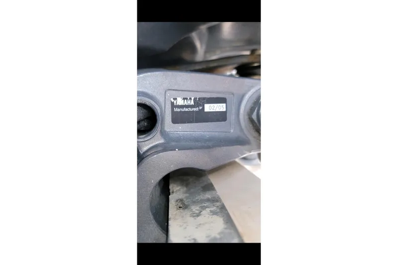 Slide: The Image of Yamaha engine part with manufacturing date label, February 2005, on Grady-White Chase 273 boat. - 162