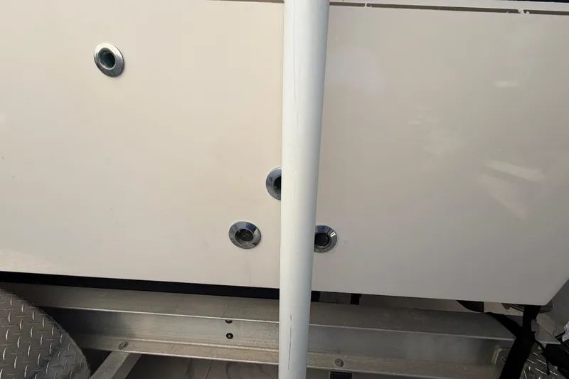 Slide: The Image of Close-up of a 2004 Grady White 273 boat hull with metal fittings. - 18