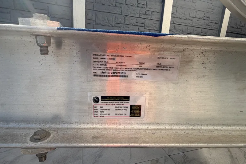 Slide: The Image of Label on trailer frame with specifications and VIN, Grady White 273, 2004 model. - 24