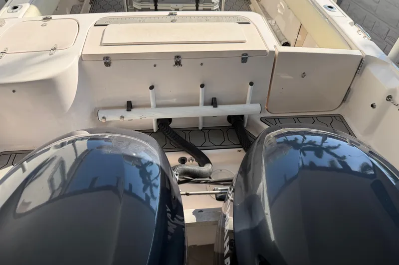 Slide: The Image of 2004 Grady White 273 boat with dual engines and storage compartments. - 29