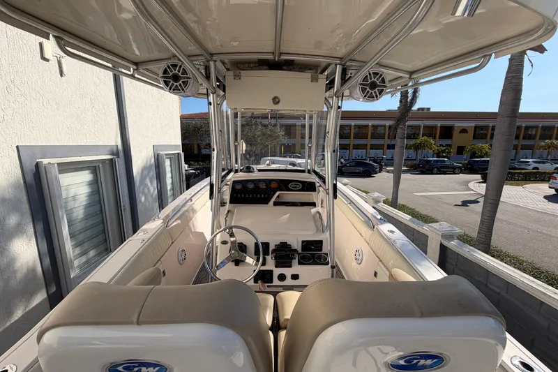 Slide: The Image of 2004 Grady White 273 boat interior with steering wheel and control panel. - 40