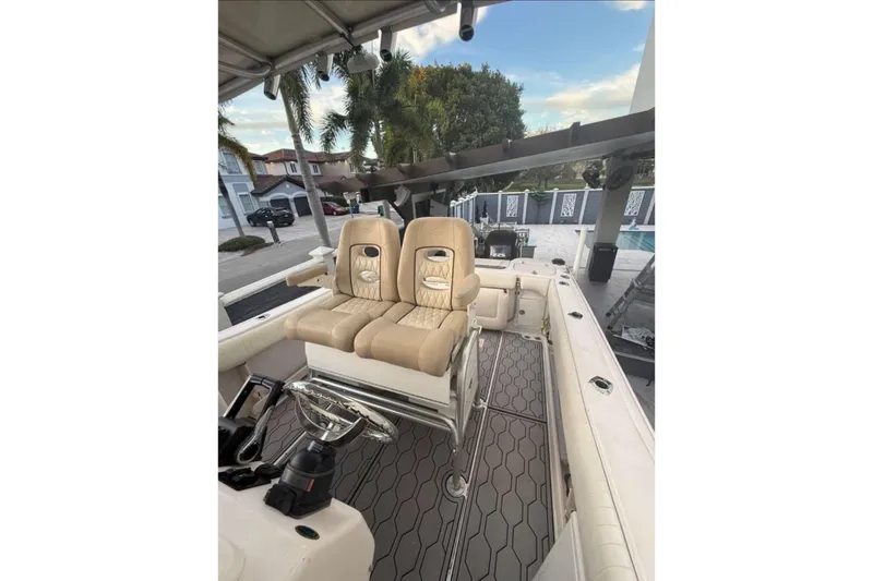 Slide: The Image of 2004 Grady-White Chase 273 boat interior with dual seats and steering wheel. - 44