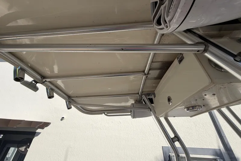 Slide: The Image of 2004 Grady White 273 boat interior with metal framework and storage compartment. - 47