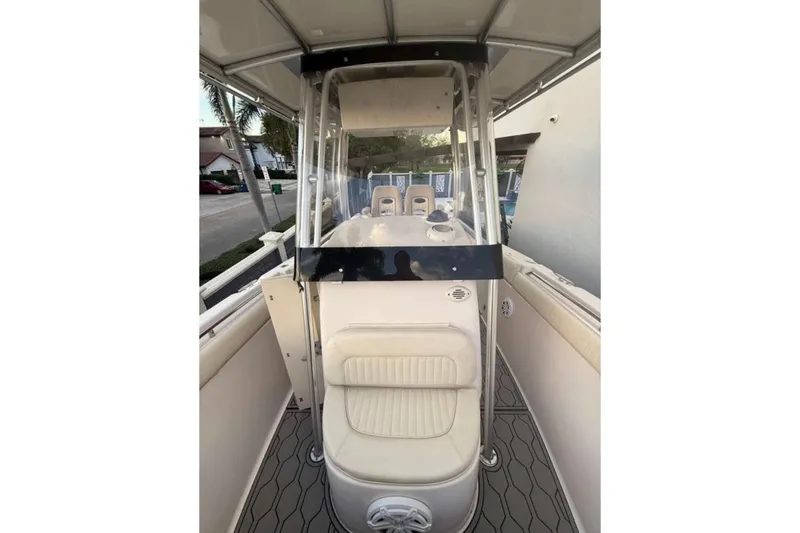 Slide: The Image of 2004 Grady-White Chase 273 boat interior with seating and console view. - 53