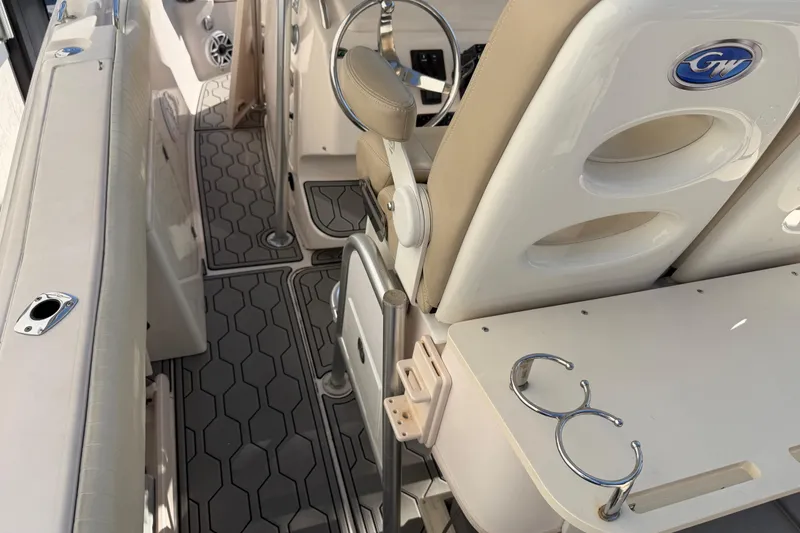 Slide: The Image of 2004 Grady White 273 boat interior with seating, cup holders, and non-slip flooring. - 61